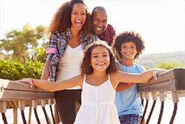 Family On A Wooden Walkway